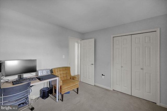 carpeted office with baseboards