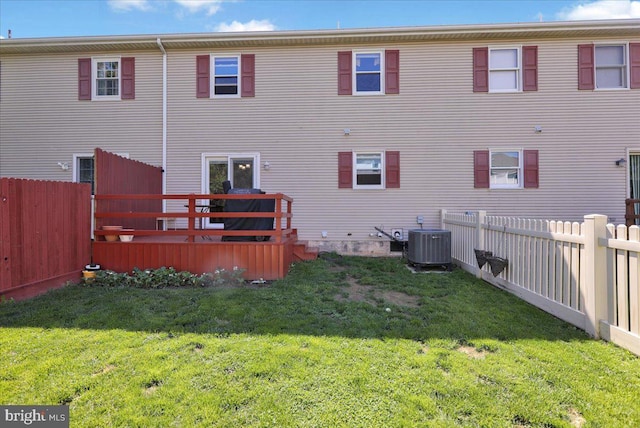 back of property featuring central AC unit