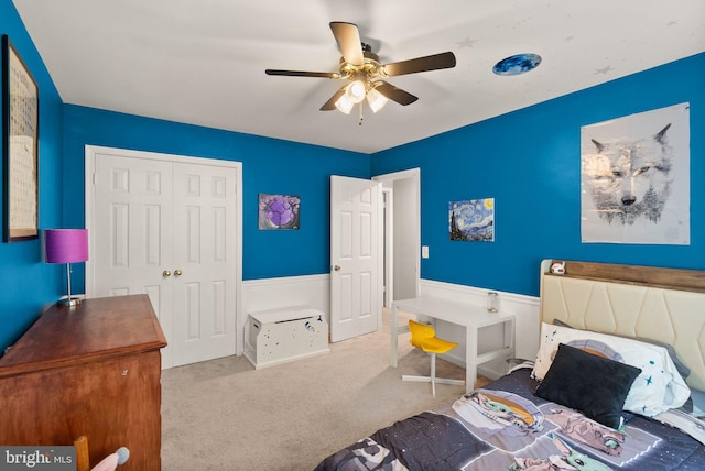 bedroom featuring a closet, carpet flooring, and ceiling fan