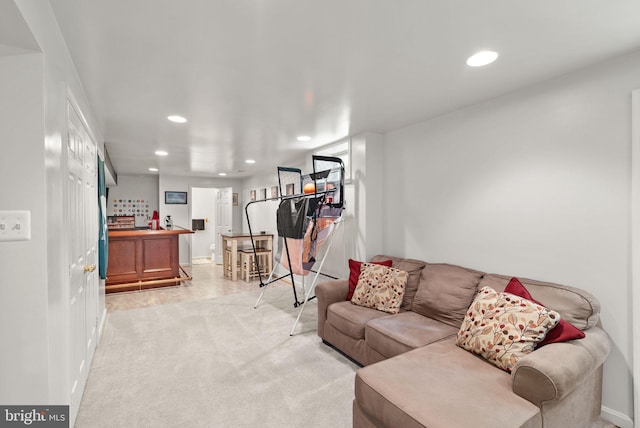 living room with recessed lighting and baseboards