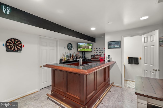 indoor bar with baseboards and recessed lighting