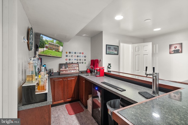 bar with a sink and recessed lighting