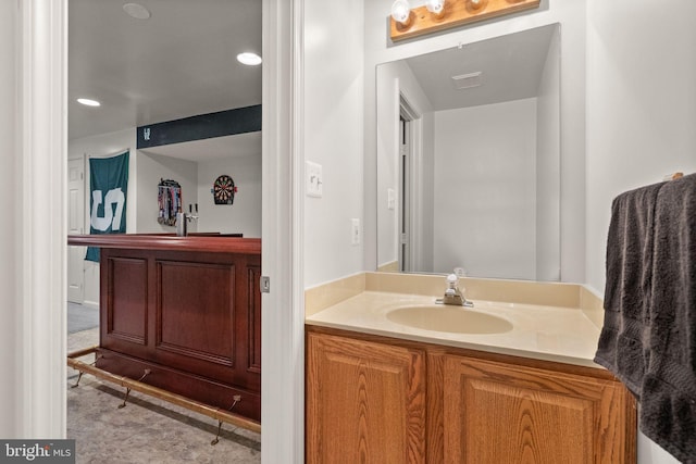 bathroom featuring vanity and recessed lighting