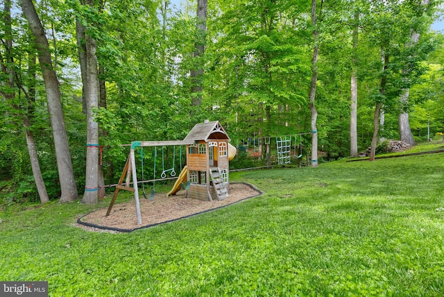 view of jungle gym featuring a lawn