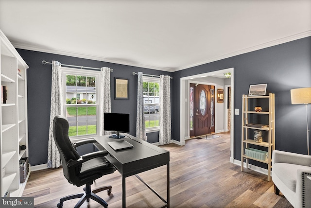 office area with ornamental molding, wood finished floors, and baseboards