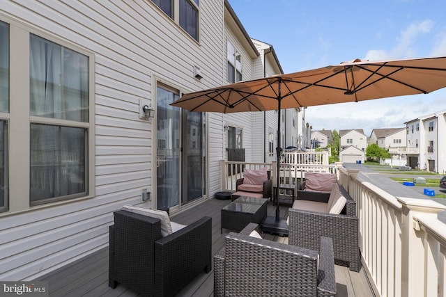 wooden terrace with an outdoor living space and a residential view