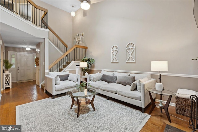 52 Kettlebrook Dr, Mount Laurel, NJ 08054 - living room with wood finished floors, stairway, a towering ceiling, baseboards, and a ceiling fan
