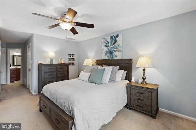 52 Kettlebrook Dr, Mount Laurel, NJ 08054 - bedroom with light carpet, baseboards, connected bathroom, and ceiling fan
