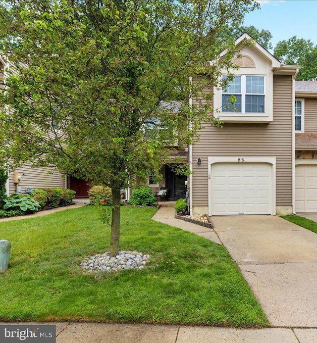 52 Kettlebrook Dr, Mount Laurel, NJ 08054 - view of front of home featuring an attached garage, a front lawn, and driveway