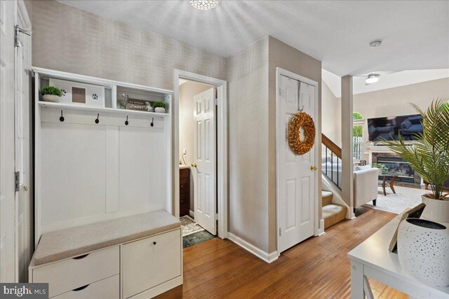 52 Kettlebrook Dr, Mount Laurel, NJ 08054 - mudroom featuring wood finished floors, baseboards, and a stone fireplace