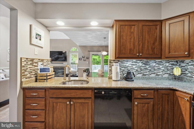52 Kettlebrook Dr, Mount Laurel, NJ 08054 - kitchen featuring dishwasher, a sink, light stone countertops, backsplash, and brown cabinetry