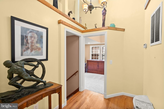 416 S Adams St, Arlington, VA 22204 - hallway featuring baseboards, light wood finished floors, and an upstairs landing