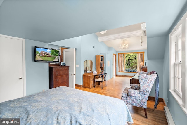 416 S Adams St, Arlington, VA 22204 - bedroom with a baseboard radiator, wood finished floors, a chandelier, lofted ceiling, and baseboards