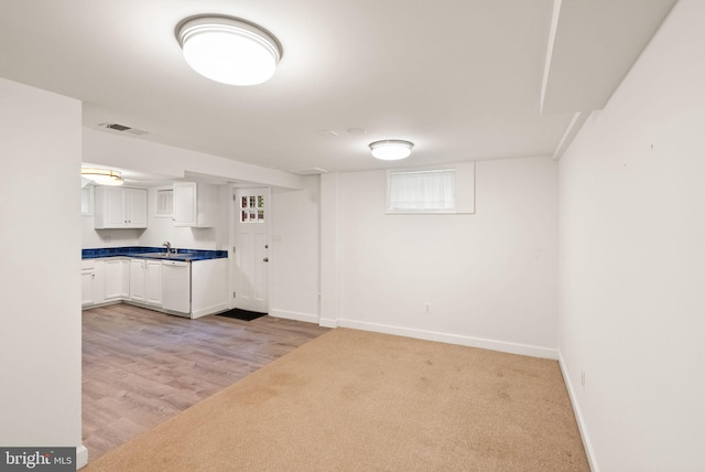 416 S Adams St, Arlington, VA 22204 - kitchen featuring white cabinets, baseboards, dishwasher, and light colored carpet