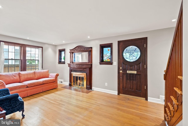 416 S Adams St, Arlington, VA 22204 - living area featuring light wood finished floors, recessed lighting, baseboards, and a fireplace with flush hearth