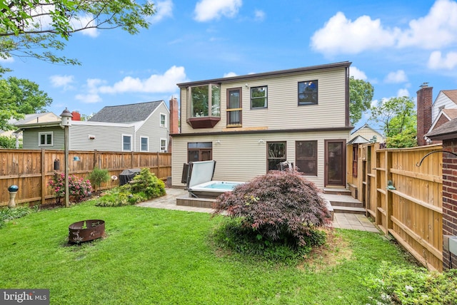 416 S Adams St, Arlington, VA 22204 - rear view of house with a fire pit and an outdoor hot tub