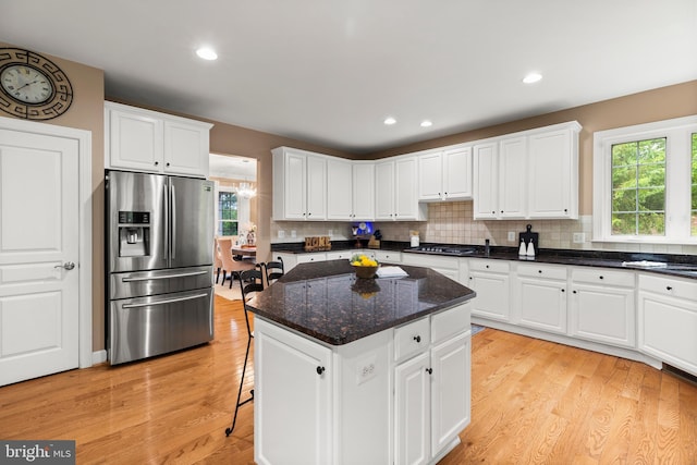 10701 Monocacy Way, Manassas, VA 20112 - kitchen featuring stainless steel refrigerator with ice dispenser, healthy amount of natural light, a center island, light wood finished floors, and recessed lighting