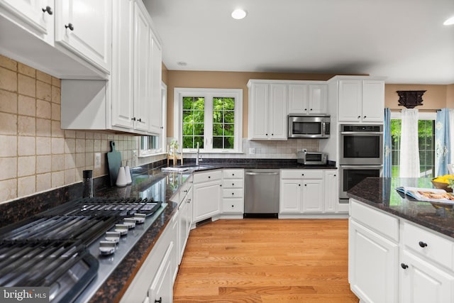 10701 Monocacy Way, Manassas, VA 20112 - kitchen featuring appliances with stainless steel finishes, healthy amount of natural light, white cabinetry, and recessed lighting