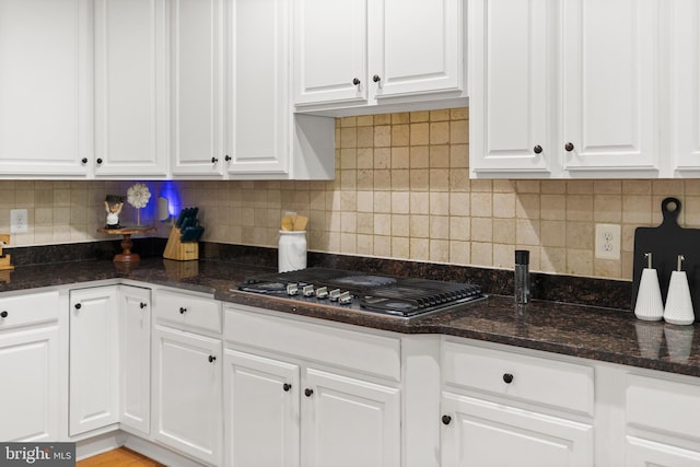10701 Monocacy Way, Manassas, VA 20112 - kitchen with stainless steel gas stovetop, white cabinets, and backsplash