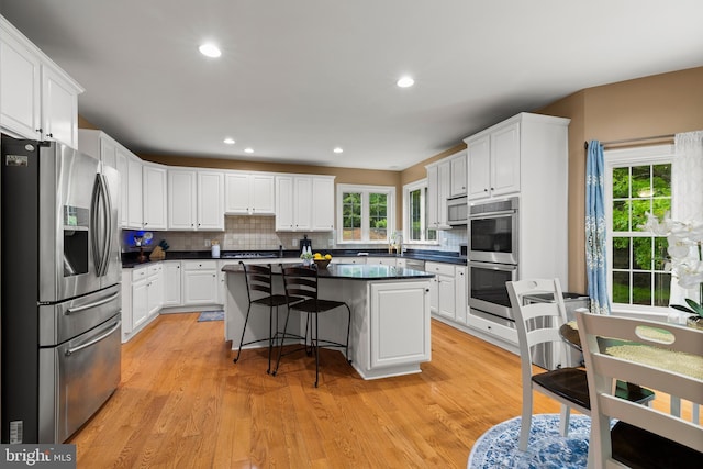 10701 Monocacy Way, Manassas, VA 20112 - kitchen with stainless steel appliances, dark countertops, white cabinets, and recessed lighting