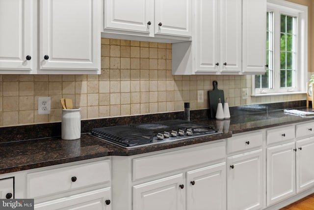 10701 Monocacy Way, Manassas, VA 20112 - kitchen with white cabinetry, stainless steel gas cooktop, dark stone countertops, and backsplash