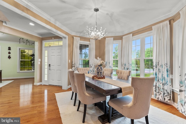 10701 Monocacy Way, Manassas, VA 20112 - dining area with a chandelier, baseboards, crown molding, and light wood finished floors