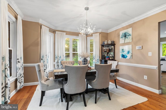 10701 Monocacy Way, Manassas, VA 20112 - dining space with a chandelier, wood finished floors, healthy amount of natural light, ornamental molding, and baseboards