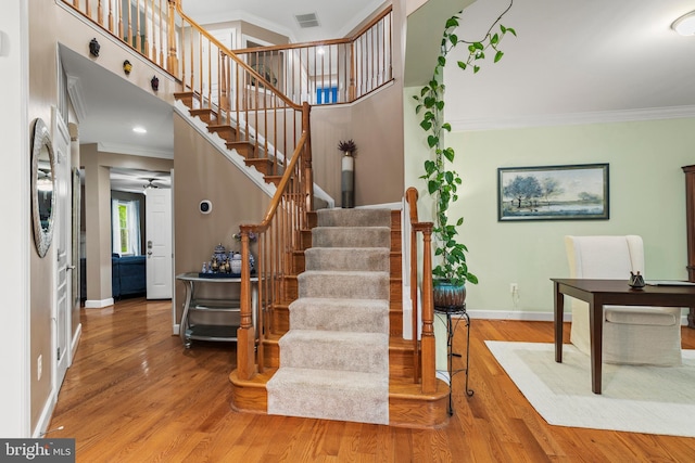 10701 Monocacy Way, Manassas, VA 20112 - stairway with ornamental molding, baseboards, and wood finished floors