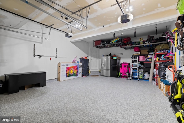 10701 Monocacy Way, Manassas, VA 20112 - garage featuring stainless steel fridge with ice dispenser and a garage door opener