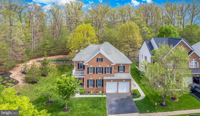 10701 Monocacy Way, Manassas, VA 20112 - view of front of property featuring brick siding, an attached garage, driveway, and a front yard