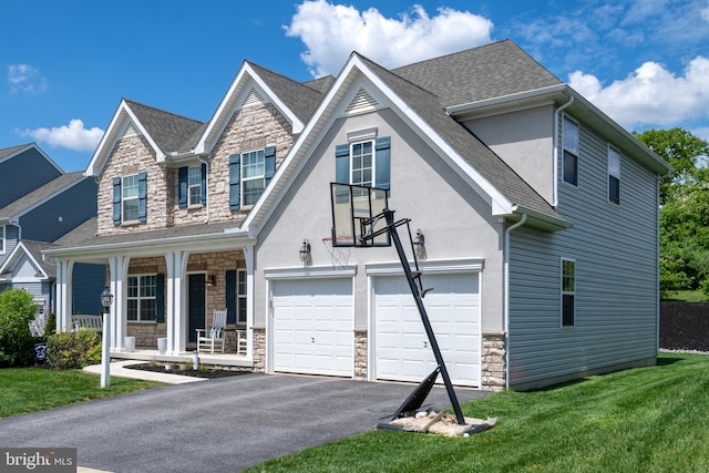 view of front of house featuring stone siding, stucco siding, driveway, and a porch