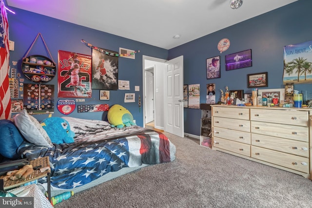 bedroom with carpet and baseboards