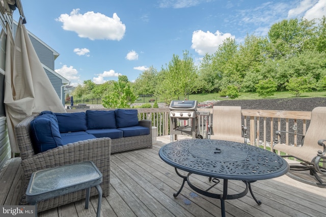 deck featuring an outdoor living space and area for grilling
