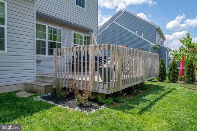 wooden deck with a yard