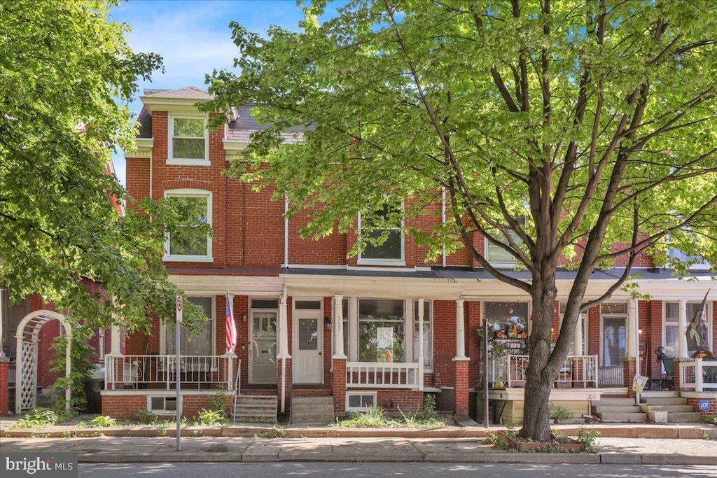 207 W Main St, Ephrata, PA 17522 - view of front of house featuring covered porch and brick siding