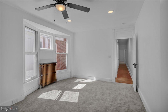 unfurnished bedroom featuring multiple windows, carpet flooring, recessed lighting, and baseboards