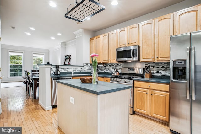 4160 Timber Log Way, Fairfax, VA 22030 - kitchen featuring stainless steel appliances, light brown cabinetry, dark countertops, light wood-type flooring, and recessed lighting