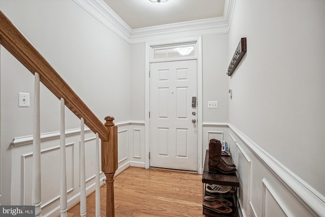 4160 Timber Log Way, Fairfax, VA 22030 - entrance foyer featuring a decorative wall, ornamental molding, light wood-style floors, and wainscoting