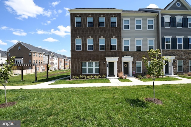 41 Green Dome Pl, Gaithersburg, MD 20878 - townhome / multi-family property featuring a front yard, a residential view, and brick siding