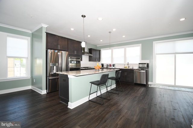 41 Green Dome Pl, Gaithersburg, MD 20878 - kitchen with stainless steel appliances, crown molding, dark brown cabinetry, a sink, and backsplash