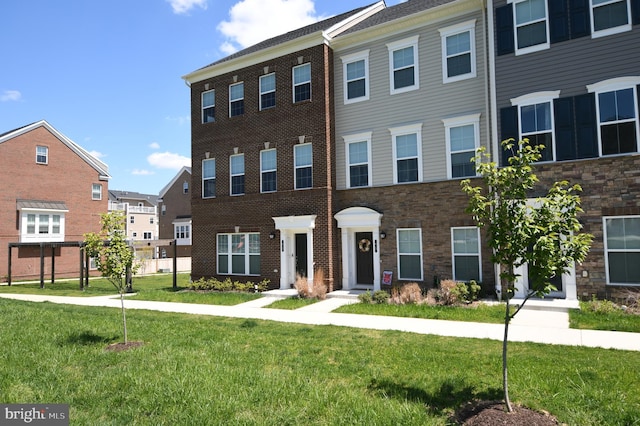 41 Green Dome Pl, Gaithersburg, MD 20878 - townhome / multi-family property featuring a front yard and stone siding
