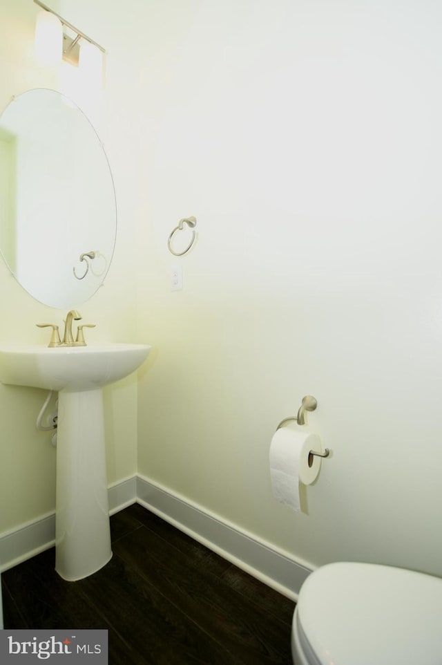 41 Green Dome Pl, Gaithersburg, MD 20878 - bathroom with baseboards, toilet, and wood finished floors