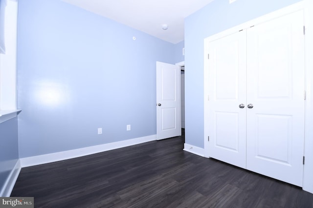 41 Green Dome Pl, Gaithersburg, MD 20878 - unfurnished bedroom with dark wood-type flooring, baseboards, and a closet