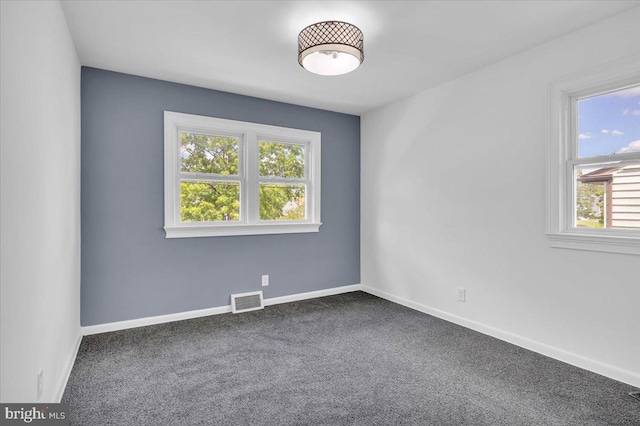 200 Boxwood Ln, Cinnaminson, NJ 08077 - empty room with plenty of natural light, dark carpet, and baseboards