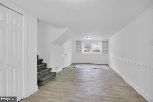 200 Boxwood Ln, Cinnaminson, NJ 08077 - bonus room with built in features, wood finished floors, baseboards, and stairway