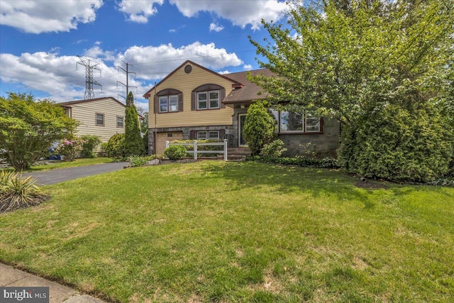 200 Boxwood Ln, Cinnaminson, NJ 08077 - tri-level home with asphalt driveway, a garage, and a front yard