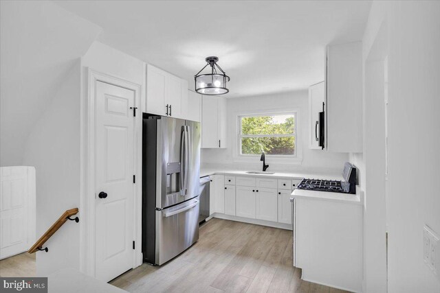 200 Boxwood Ln, Cinnaminson, NJ 08077 - kitchen featuring stainless steel fridge with ice dispenser, a sink, light countertops, and white cabinetry