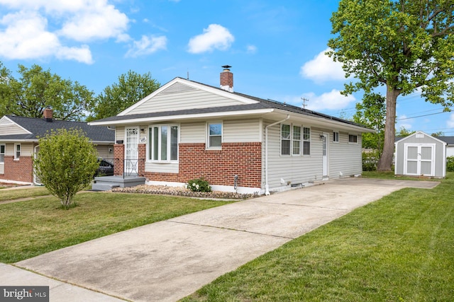 view of front facade with a shed, brick siding, an outdoor structure, a chimney, and a front lawn