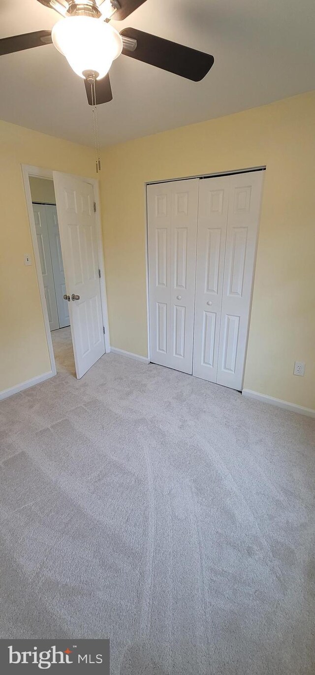 16620 Galt Ct, Woodbridge, VA 22191 - unfurnished bedroom featuring light carpet, baseboards, a ceiling fan, and a closet