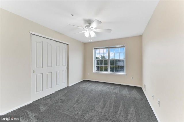 1707 Waters Edge Dr Unit 07, Newark, DE 19702 - unfurnished bedroom featuring dark colored carpet, baseboards, a closet, and ceiling fan